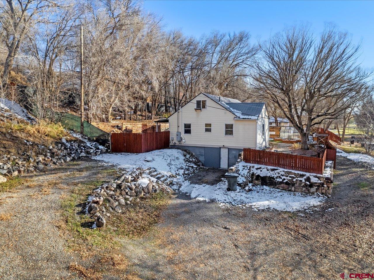 608 Bluff Street Delta, CO 81416 - Photo 24 of 45 a front view of a house with a yard