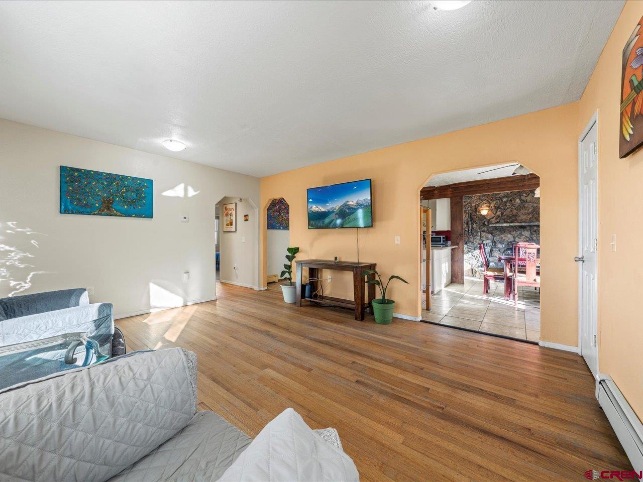 608 Bluff Street Delta, CO 81416 - Photo 27 of 45 a living room with furniture and a wooden floor