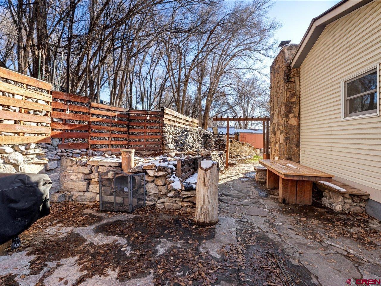 608 Bluff Street Delta, CO 81416 - Photo 40 of 45 a backyard of a house with barbeque oven