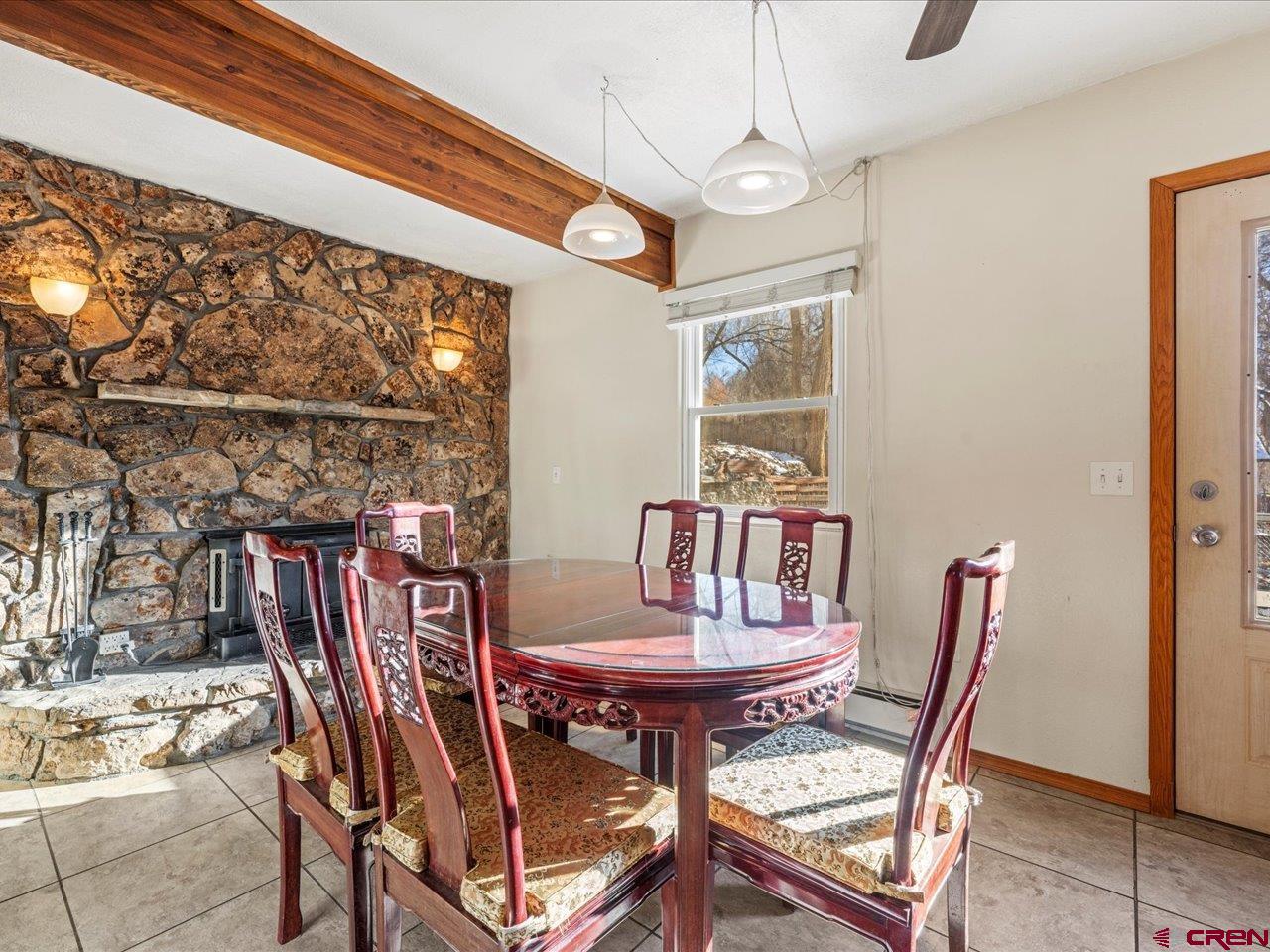608 Bluff Street Delta, CO 81416 - Photo 7 of 45 a view of a dining room with furniture and a window