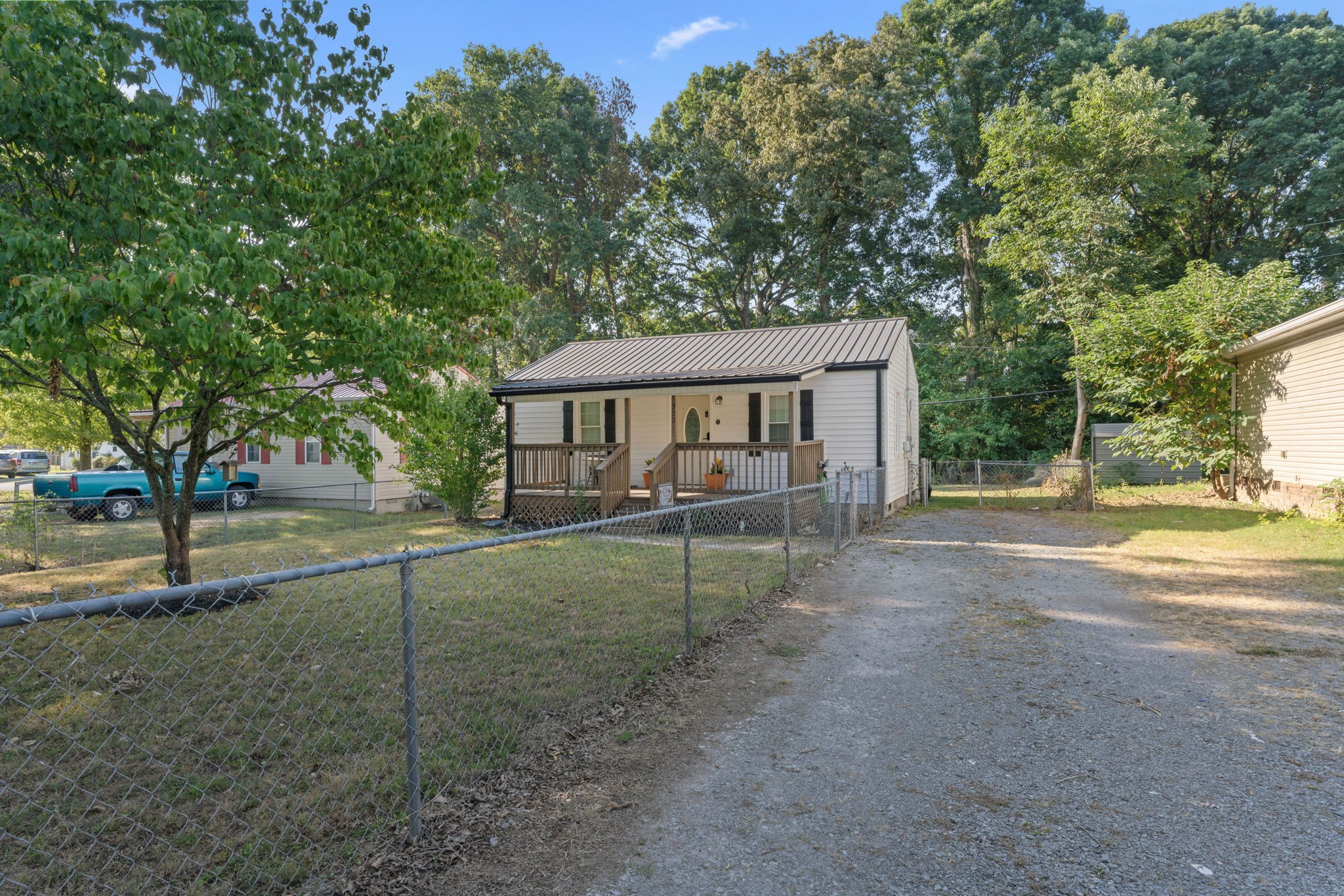 332 Oakwood Road Tullahoma, TN 37388 - Photo 2 of 17 a view of house with outdoor space and trees in the background