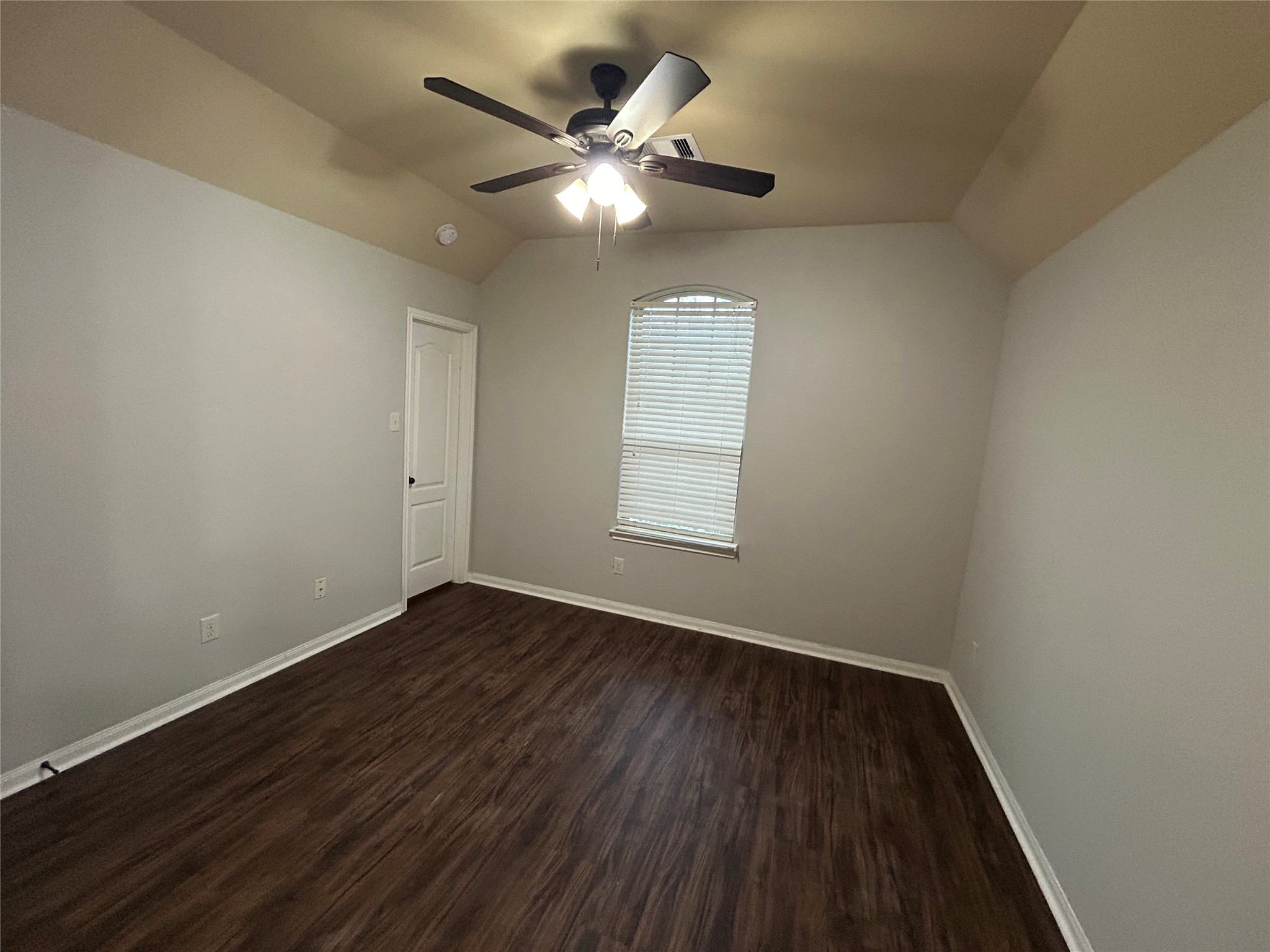 7936 Lake Commons Drive Rosenberg, TX 77469 - Photo 26 of 33 an empty room with wooden floor and windows