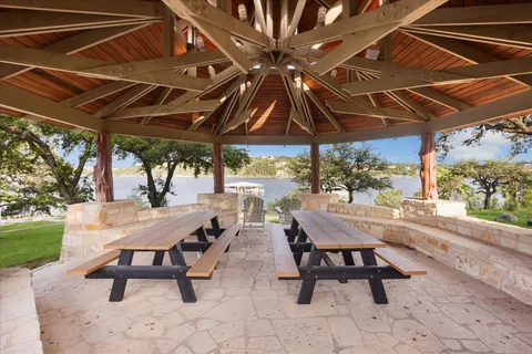 a view of a backyard with sitting area