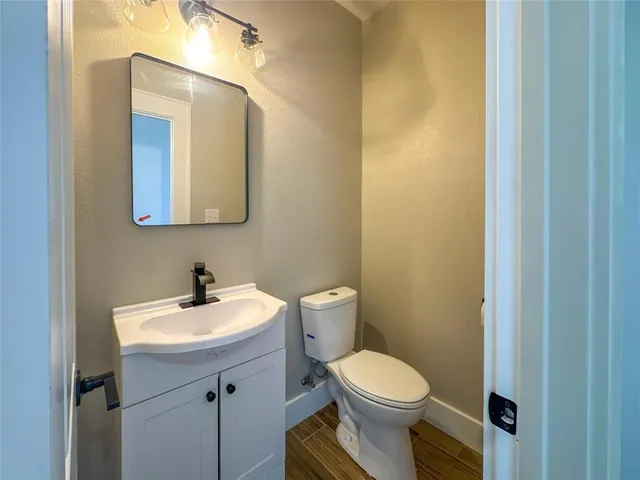 a view of an empty room with a floor to ceiling window and garden view