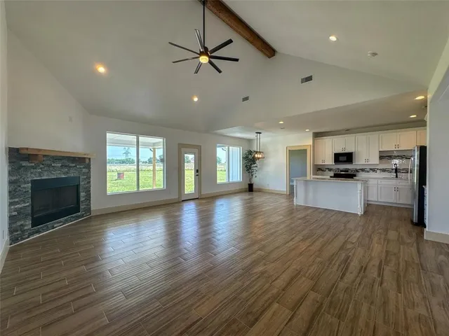 a view of a kitchen with a sink and a stove top oven