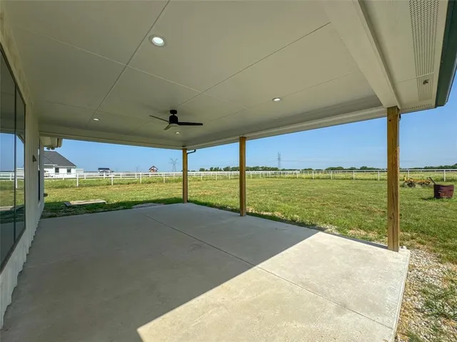 a front view of a house with yard and green space
