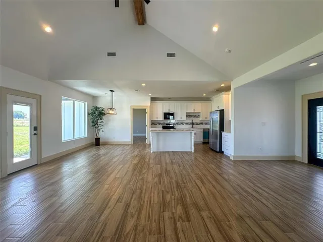 a view of kitchen with furniture and wooden floor