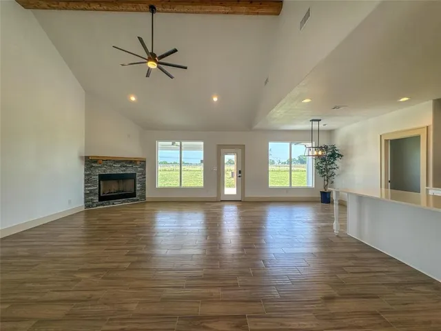a open kitchen with white cabinets and stainless steel appliances