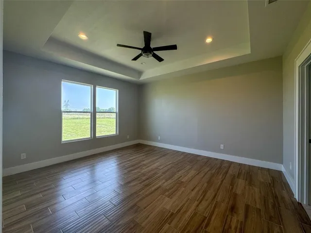 a spacious bathroom with a bathtub and shower