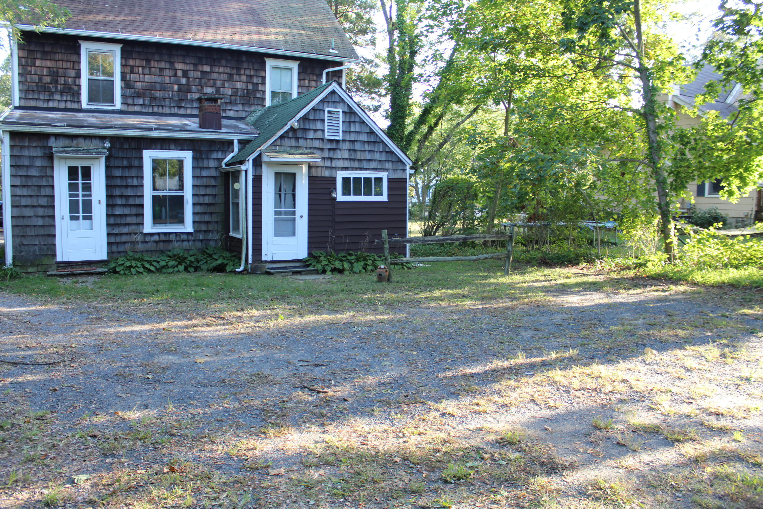 34 Ridge Road Rumson, NJ 07760 - Photo 2 of 3 a front view of a house with a yard
