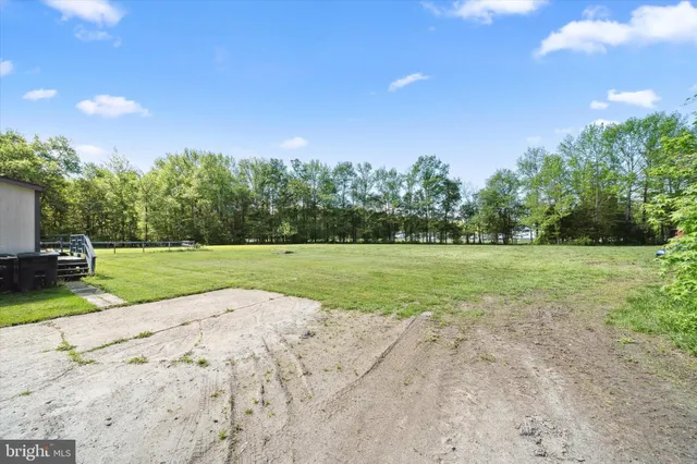 a view of a backyard of the house