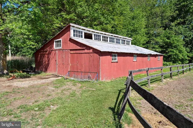 a view of a house with a yard and plants