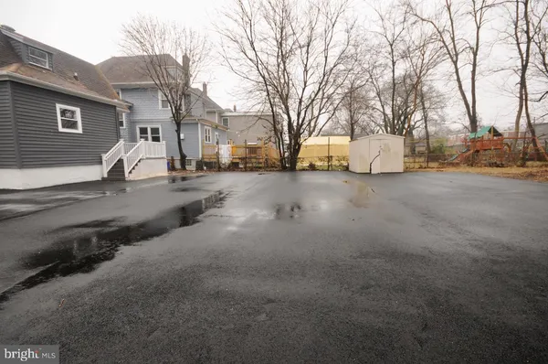 a view of a road with a house