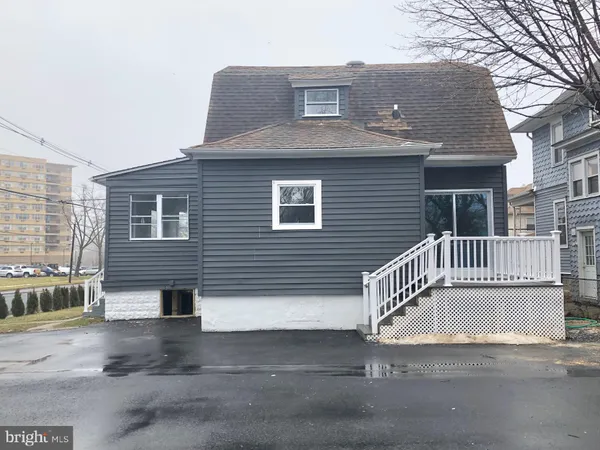 a front view of a house with a garage