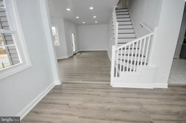a view of entryway with wooden floor
