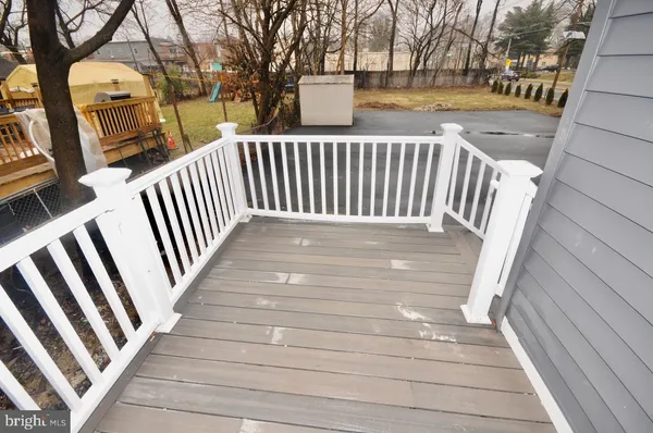 a view of outdoor space with deck and kitchen