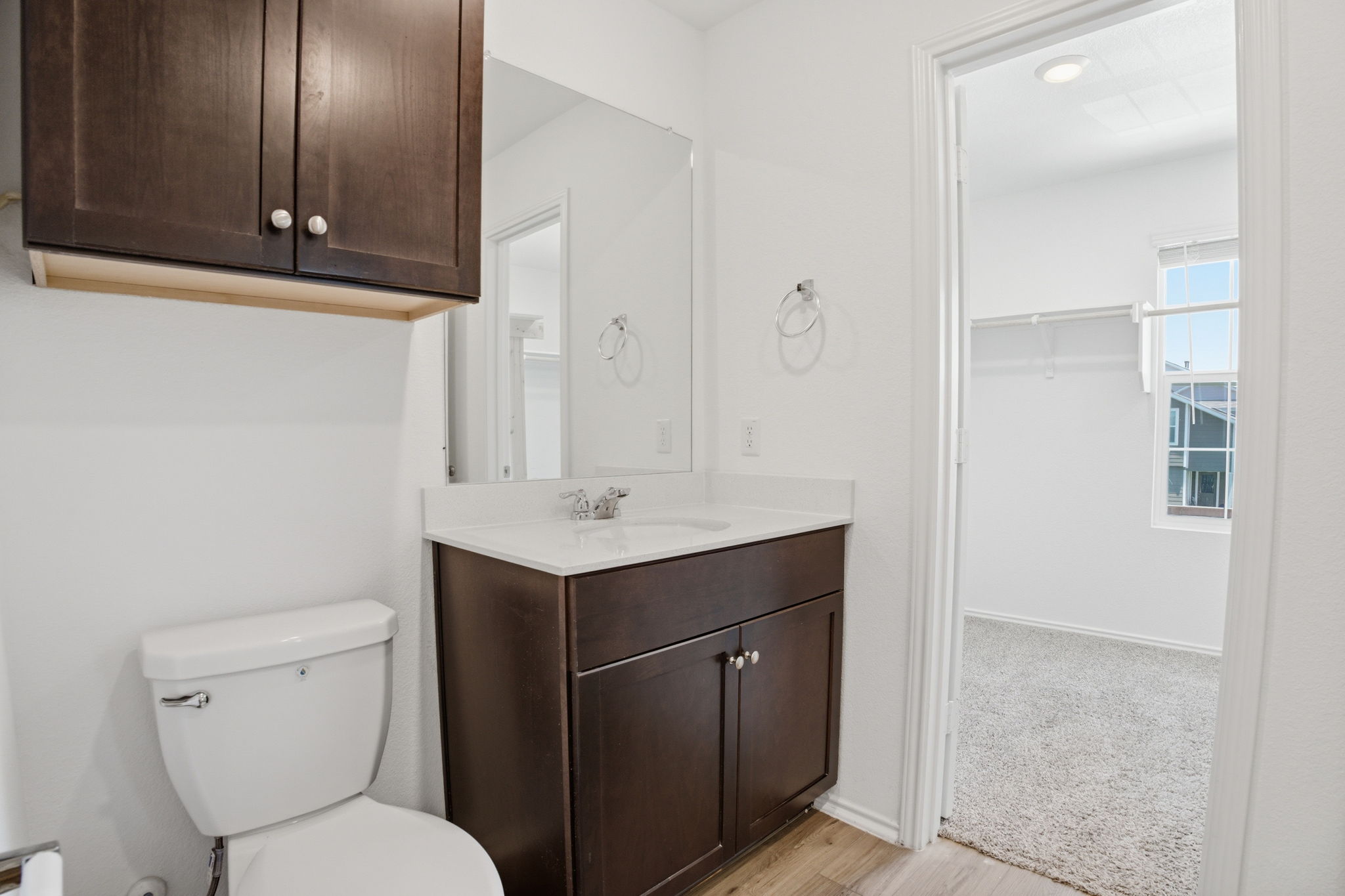 12213 Rising Moon Lane Del Valle, TX 78617 - Photo 9 of 19 a bathroom with a toilet sink and mirror