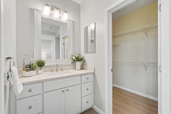 a bathroom with a double vanity sink and mirror