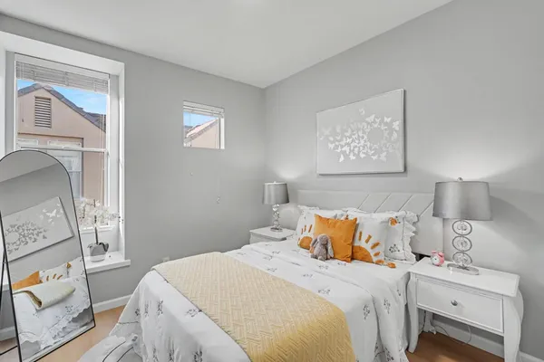 a bedroom with a bed and a window