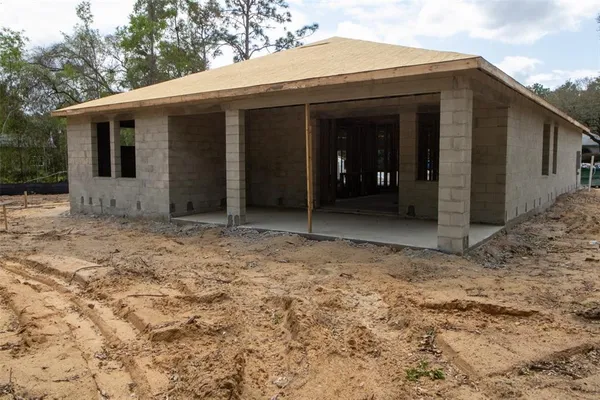 a view of house with backyard of the house