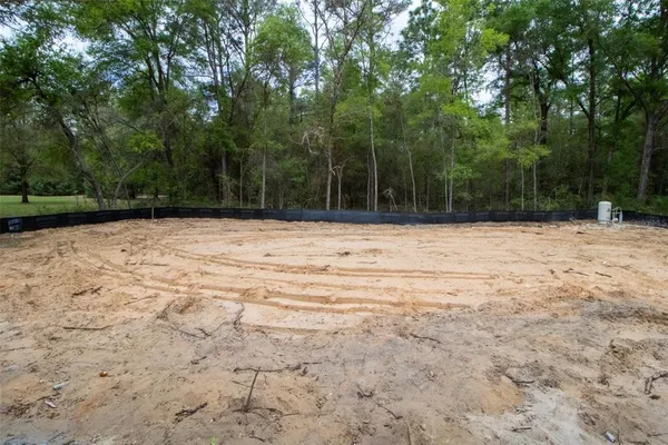 a white house covered with snow in the background