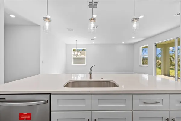 a kitchen with a sink and cabinets