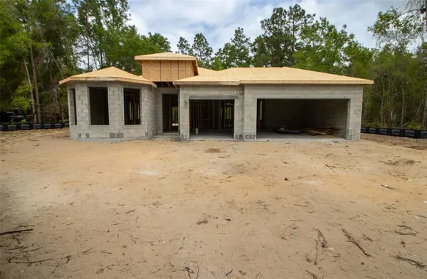 a front view of a house with yard
