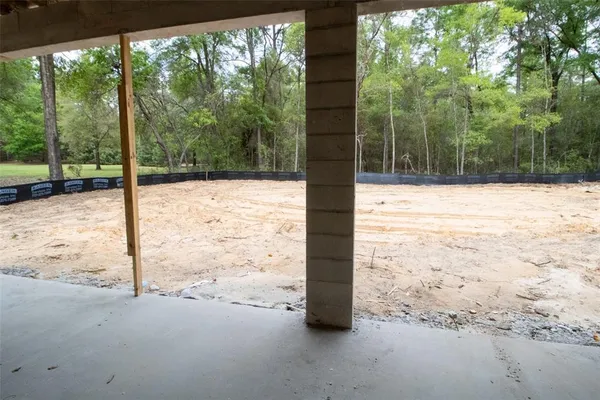 a view of ocean view and tree next to a yard