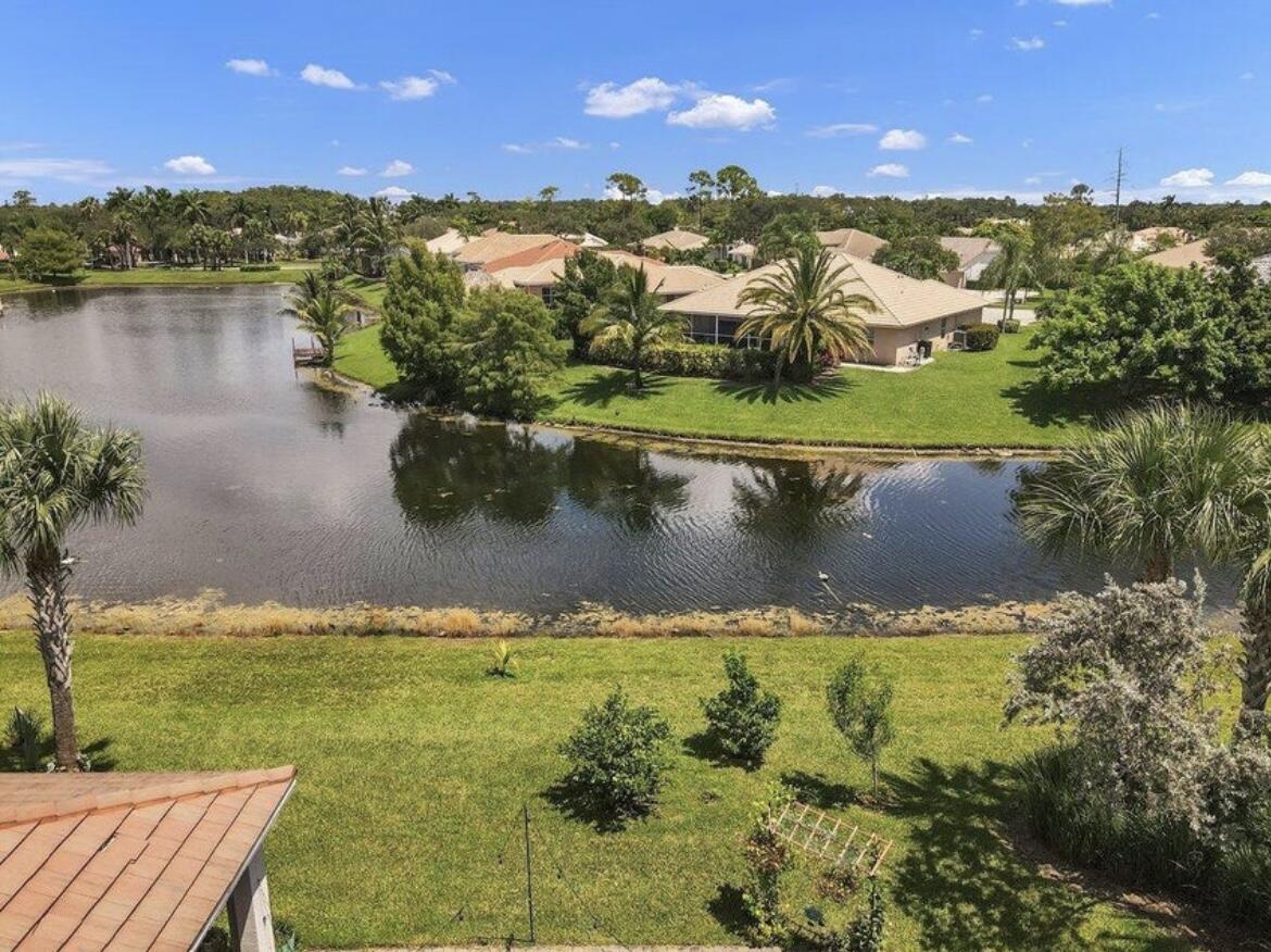 11971 Cypress Key Way Royal Palm Beach, FL 33411 - Photo 14 of 19 a view of a lake with a houses