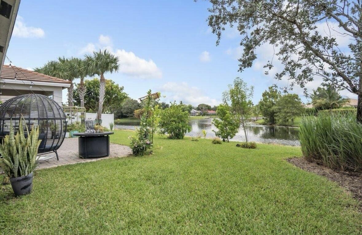 11971 Cypress Key Way Royal Palm Beach, FL 33411 - Photo 15 of 19 a view of a garden