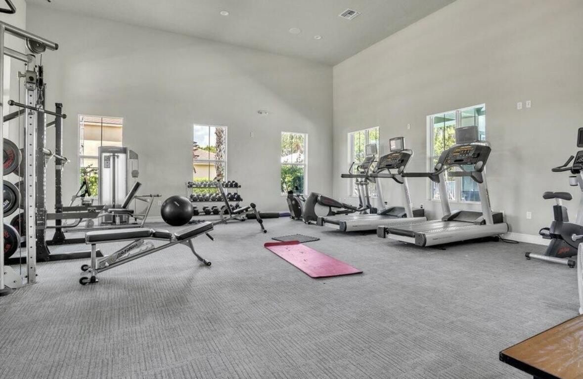 11971 Cypress Key Way Royal Palm Beach, FL 33411 - Photo 17 of 19 a view of a room with gym equipment