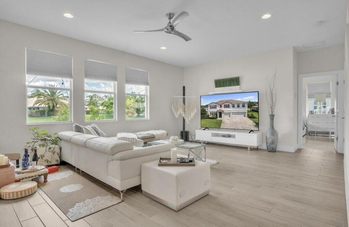 11971 Cypress Key Way Royal Palm Beach, FL 33411 - Photo 5 of 19 a living room with furniture and windows