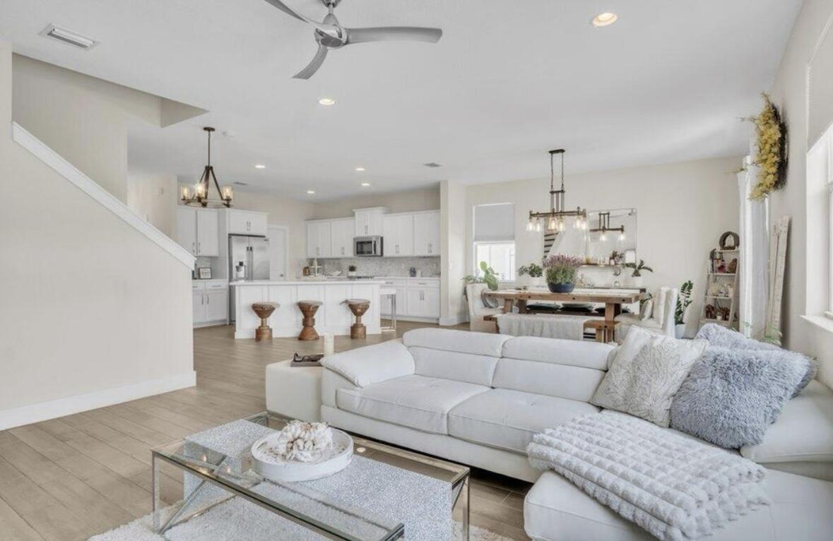 11971 Cypress Key Way Royal Palm Beach, FL 33411 - Photo 6 of 19 a living room with furniture and kitchen view