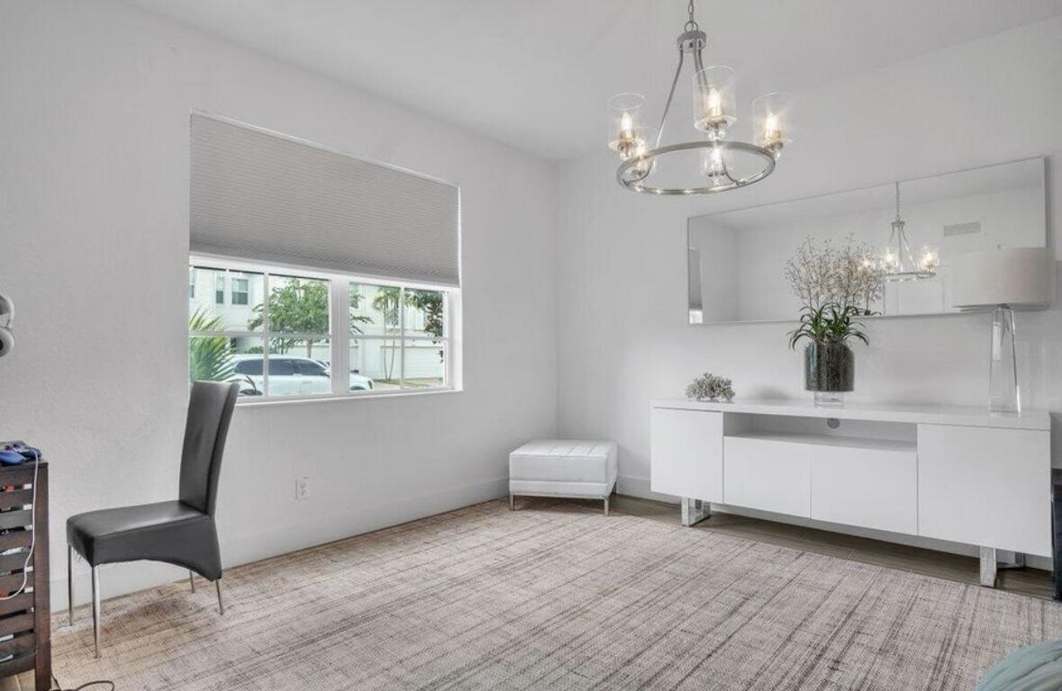 11971 Cypress Key Way Royal Palm Beach, FL 33411 - Photo 7 of 19 a view of a bedroom with furniture window and wooden floor