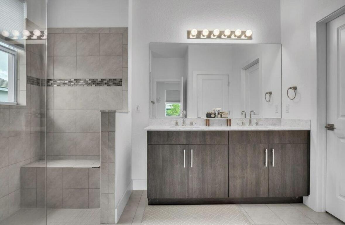 11971 Cypress Key Way Royal Palm Beach, FL 33411 - Photo 9 of 19 a bathroom with a sink and a mirror