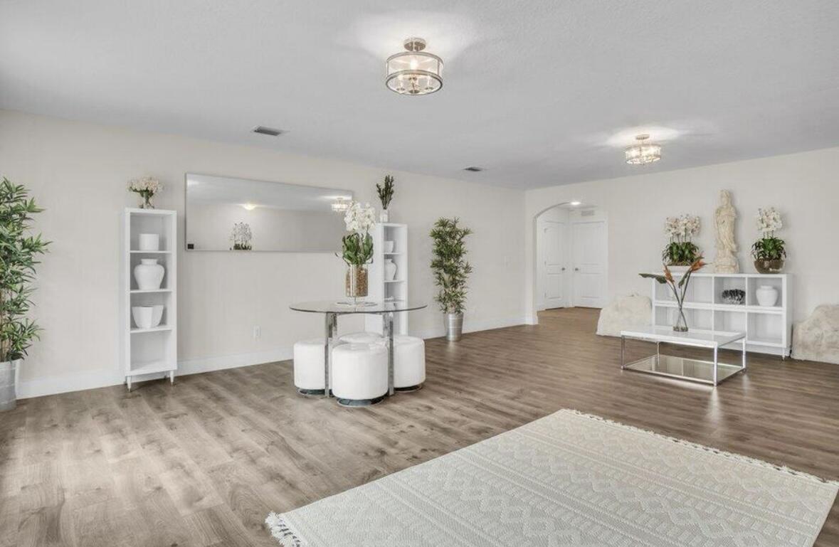 11971 Cypress Key Way Royal Palm Beach, FL 33411 - Photo 10 of 19 a living room with dining room and wooden floor