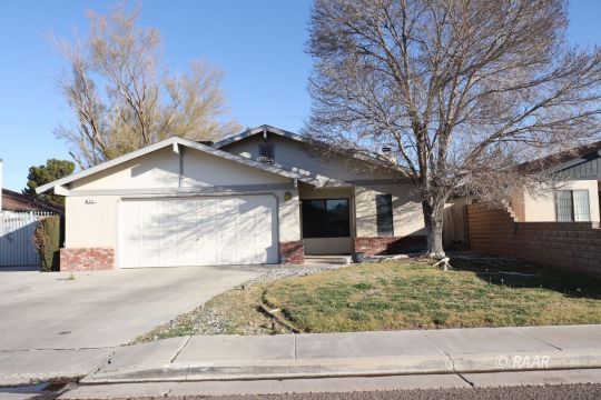 824 Walker Lane Ridgecrest, CA 93555 - Photo 1 of 20 a front view of a house with garden