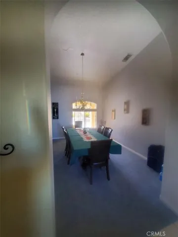 a view of an empty room and a window