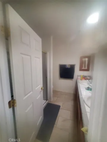 a bed sitting in a room next to a window