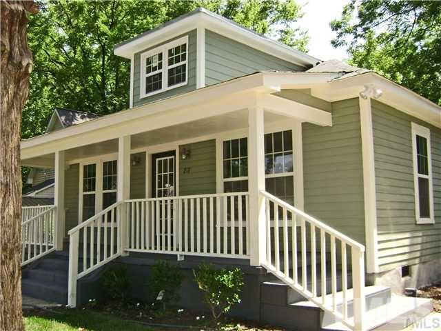 217 Camden Street Raleigh, NC 27601 - Photo 2 of 14 a view of a house with a small yard and wooden floor and fence