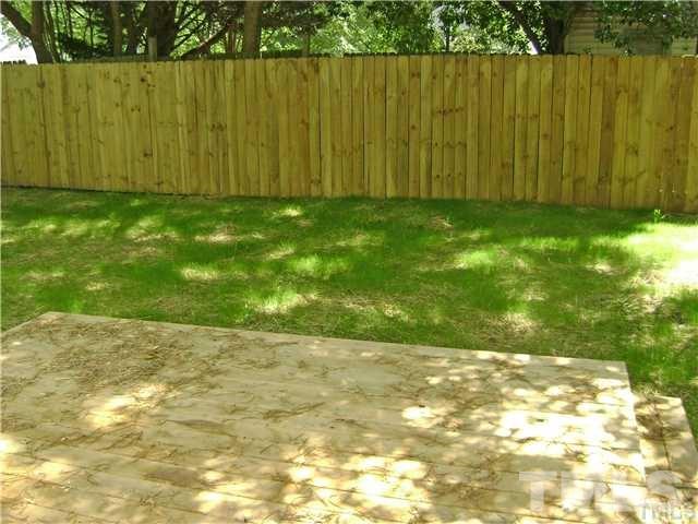 217 Camden Street Raleigh, NC 27601 - Photo 13 of 14 a view of a yard with a wooden fence