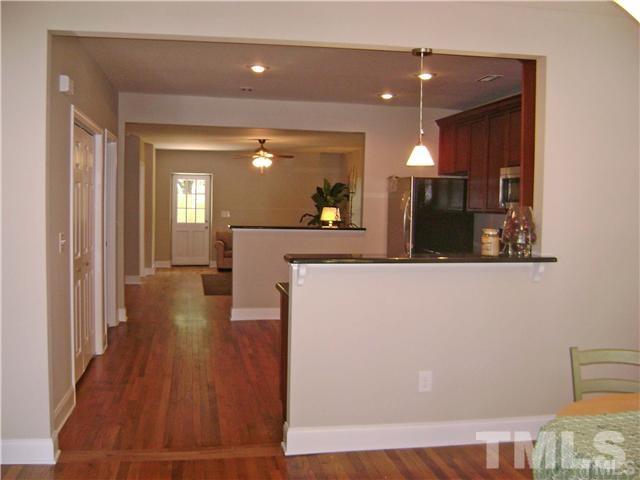 217 Camden Street Raleigh, NC 27601 - Photo 3 of 14 a view of a living room with wooden floor