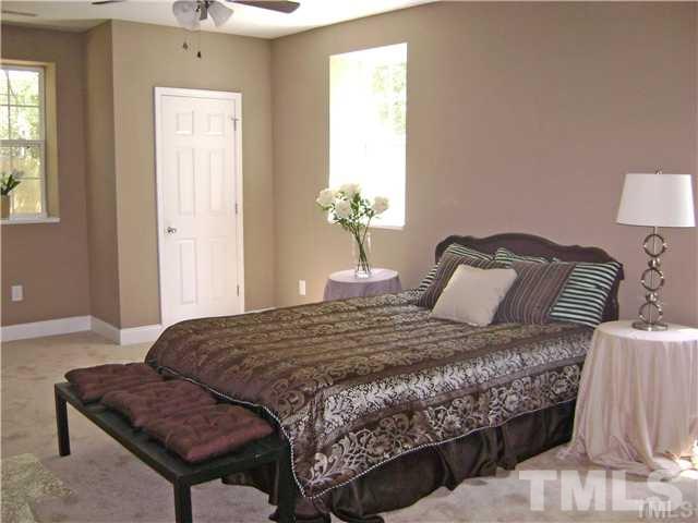 217 Camden Street Raleigh, NC 27601 - Photo 10 of 14 a bedroom with a bed and window
