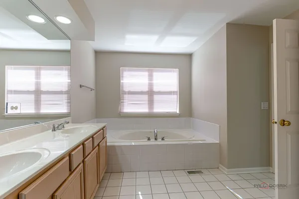a bathroom with a bathtub and a sink