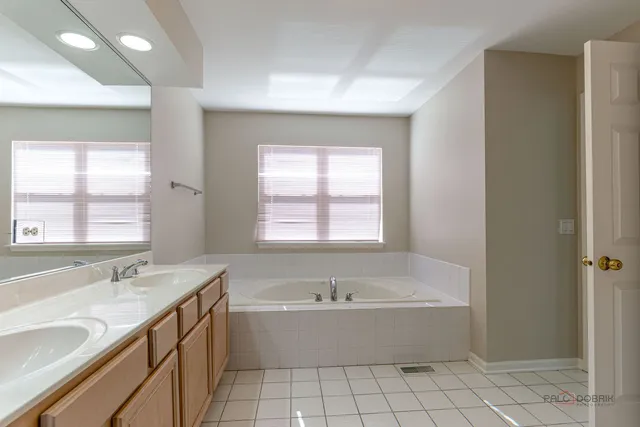 a bathroom with a bathtub and a sink