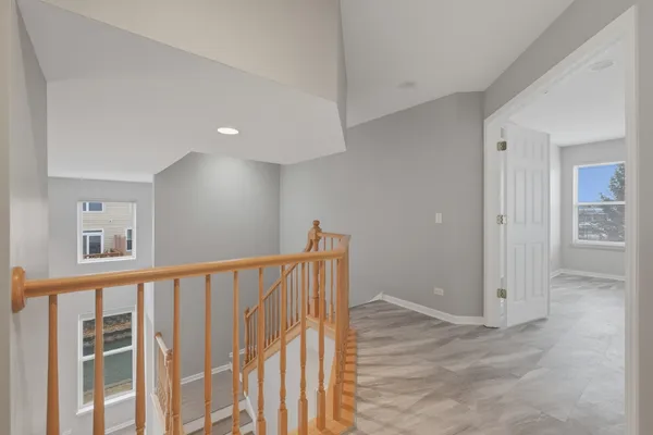 a view of staircase with wooden floor
