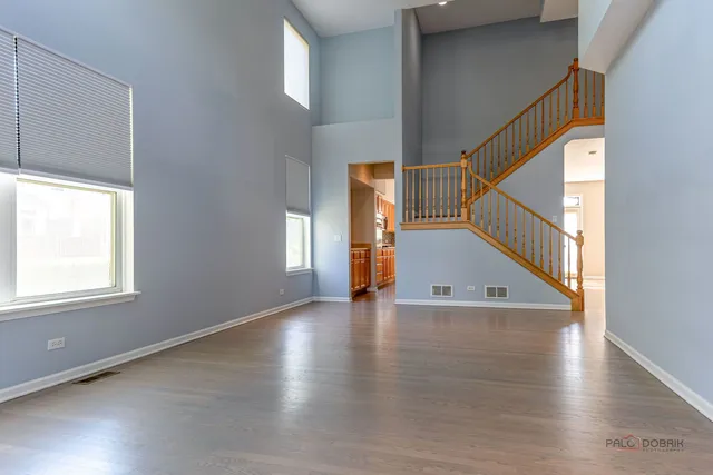 a view of an entryway with wooden floor