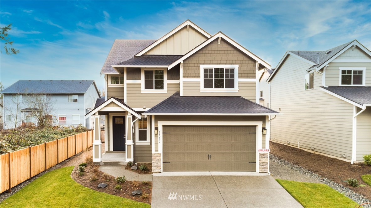 5202 Northeast 24th Street Renton, WA 98059 - Photo 1 of 22 a front view of a house with a yard