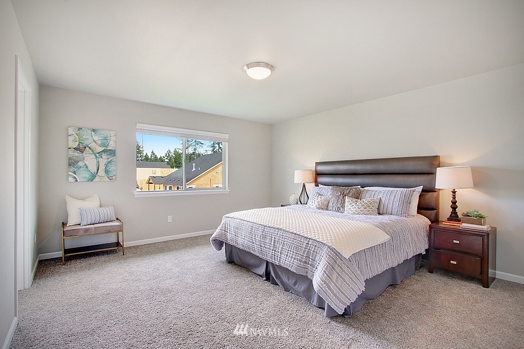 5202 Northeast 24th Street Renton, WA 98059 - Photo 13 of 22 a bedroom with a bed and a window