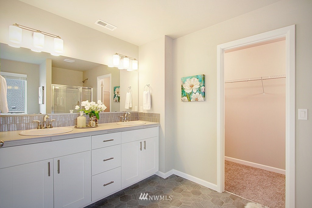 5202 Northeast 24th Street Renton, WA 98059 - Photo 14 of 22 a bathroom with a double vanity sink and a mirror